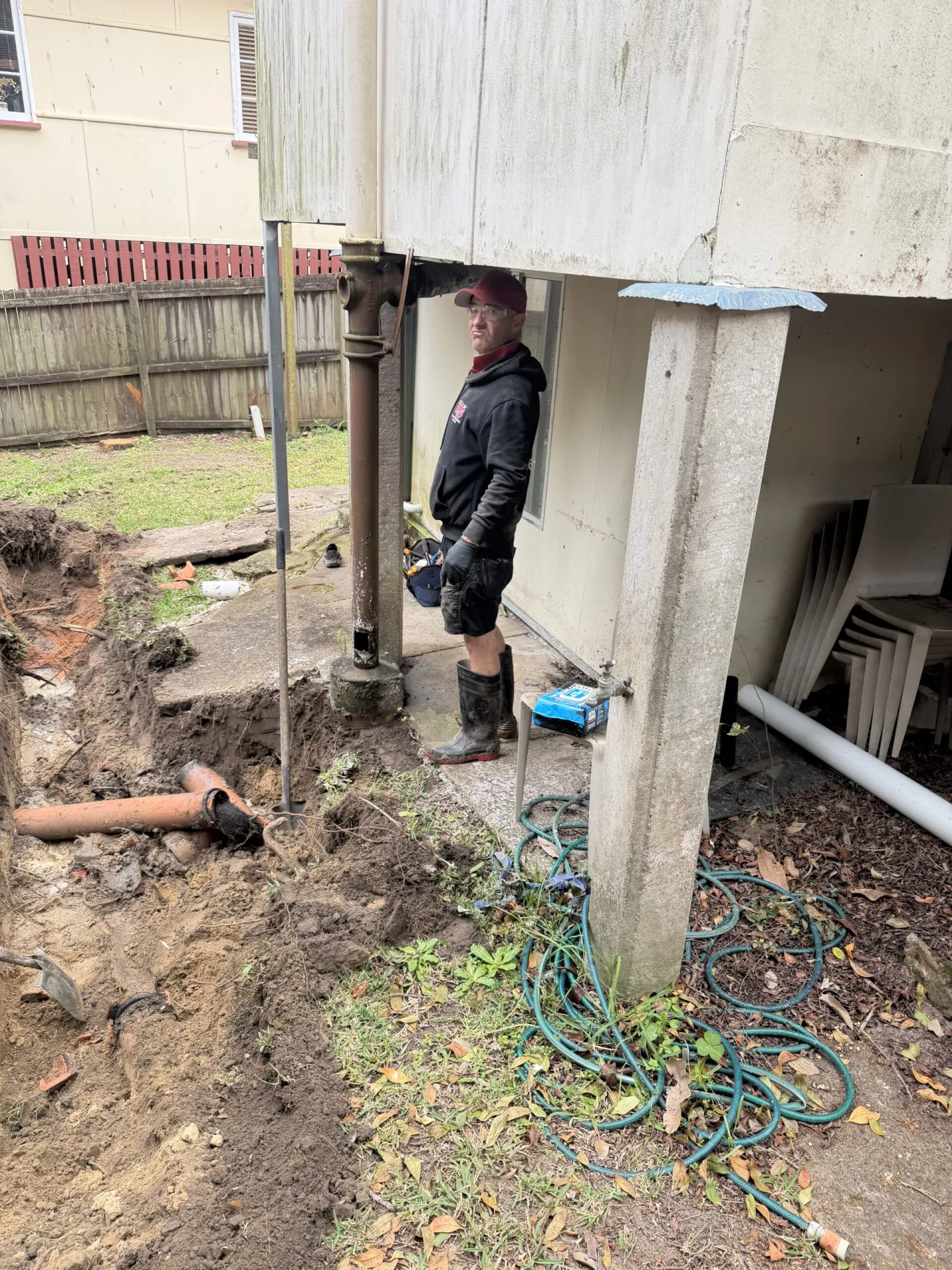 Excavation for an underground pipe repair at a Logan home